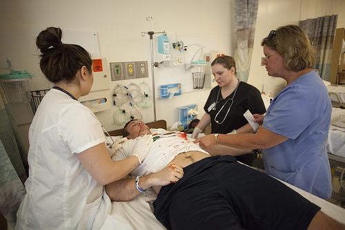 Nurses working with a patient
