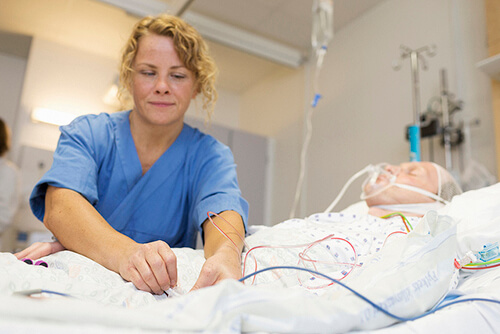 A nurse works with a patient.